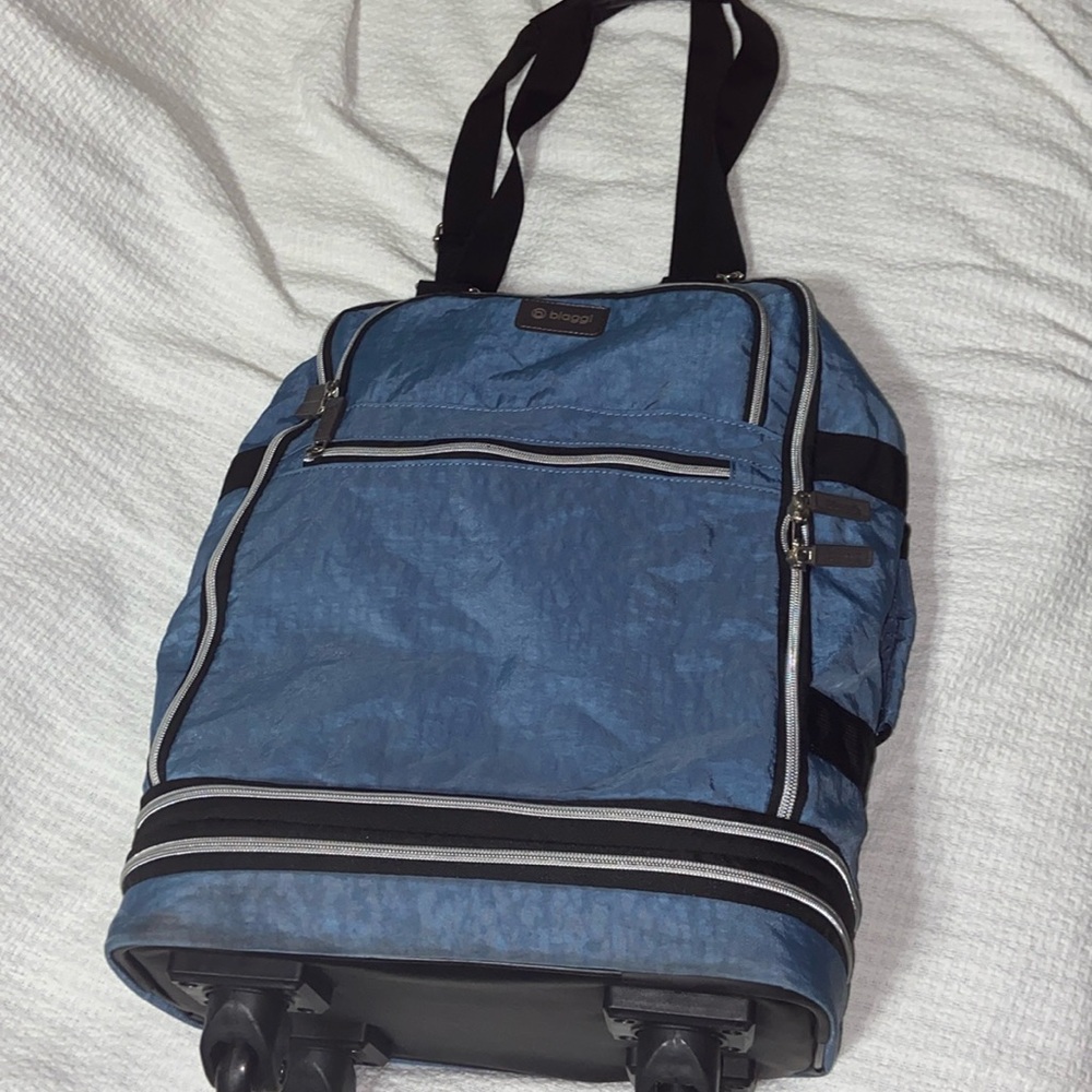 Biaggi rolling expandable spinner foldable carry on
